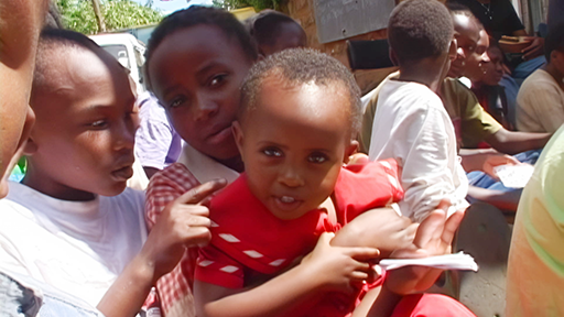 Children at an orphanage enjoy music being brought in from a non-profit organization.