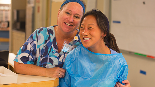 A nurse smiles with her patient at Seattle Cancer Care Alliance.